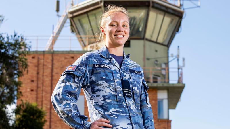 Air traffic controller Flight Lieutenant Amy Tinto, from No. 452 Squadron, in front of the air traffic control tower at RAAF Base Townsville during Exercise Talisman Sabre 2021. Photo: Leading Aircraftwoman Emma Schwenke