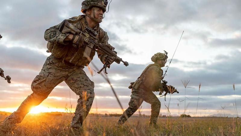 US Marines from 1st Battalion, 7th Marines, moves forward during an assault on Bowen Airport in Queensland on Exercise Talisman Sabre. Photo: Leading Aircraftwoman Jacqueline Forrester 