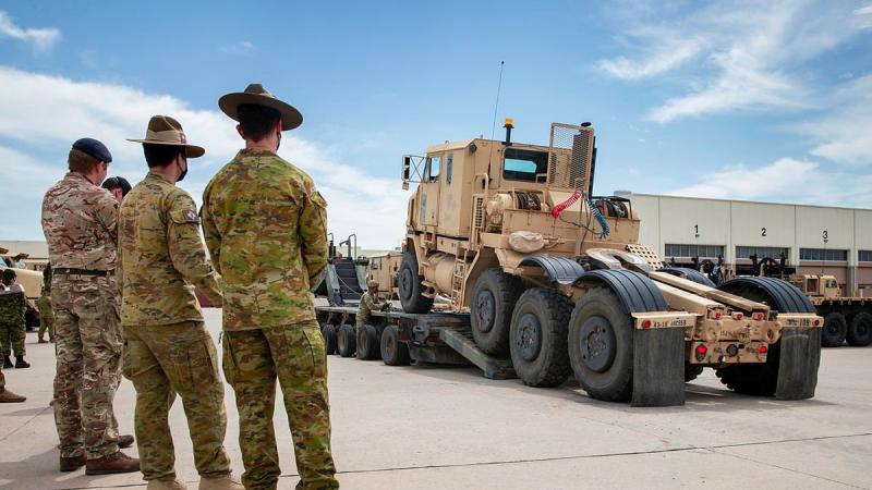 Soldiers from the US Army's 14th Sustainment Brigade demonstrate their vehicle-recovery capabilities to soldiers from the Australian, British and Canadian armies during the Joint Warfighting Assessment. Photo: Corporal Nicole Dorrett