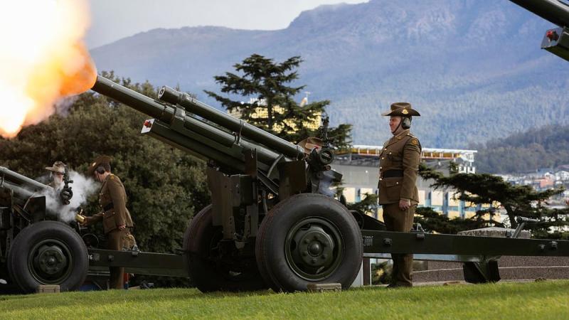 An M2A2 105 mm Howitzer crewed by Army soldiers from the 9th Regiment, Royal Australian Artillery, fires an 18-gun salute during the 150th Anniversary of Australian Artillery Commemorative Service at the Hobart Cenotaph. Photo: Private Hamish Rogers
