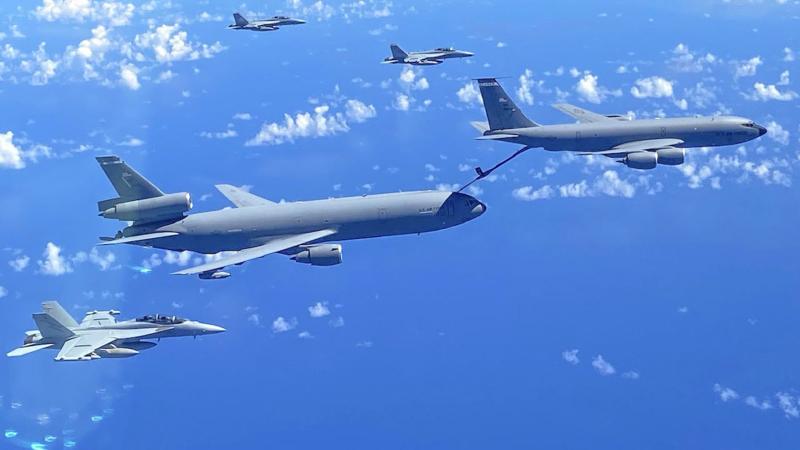 A United States Air Force KC-135 Stratotanker refuels a KC-10 Extender during the ferrying of No. 6 Squadron EA-18G Growlers to the United States. Photo: Flight Lieutenant Antonia