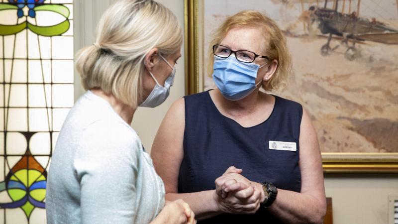 The secretary of Australian Defence Force Nurses Association, Robyn Green, right, talks to an Australian Defence nurse during the luncheon in Brisbane.