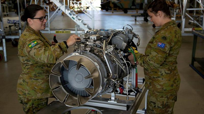 Corporal Shayna Antonio, left, and Sergeant Phillipa Finlay conduct an inspection on an MRH-90 Taipan engine at the Army Aviation Training Centre, Oakey, Queensland. Photo: Mary McKenzie