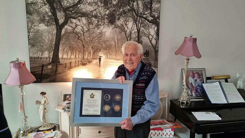 World War II veteran Geoff Bydder with his Air Force 2021 commemorative memento.