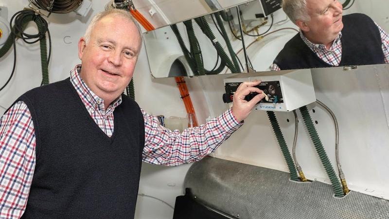 Dr Gordon Cable checks instruments within the training hypobaric chamber during his part-time role with the Institute of Aviation Medicine at RAAF Base Edinburgh. Photo: Corporal Brenton Kwaterski