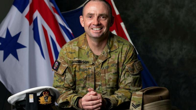 Midshipman Benjamin Anderson with his Navy officer's cap and Army slouch hat after transferring services and commissioning as a maritime logistics officer with Navy. Photo: Leading Seaman Shane Cameron