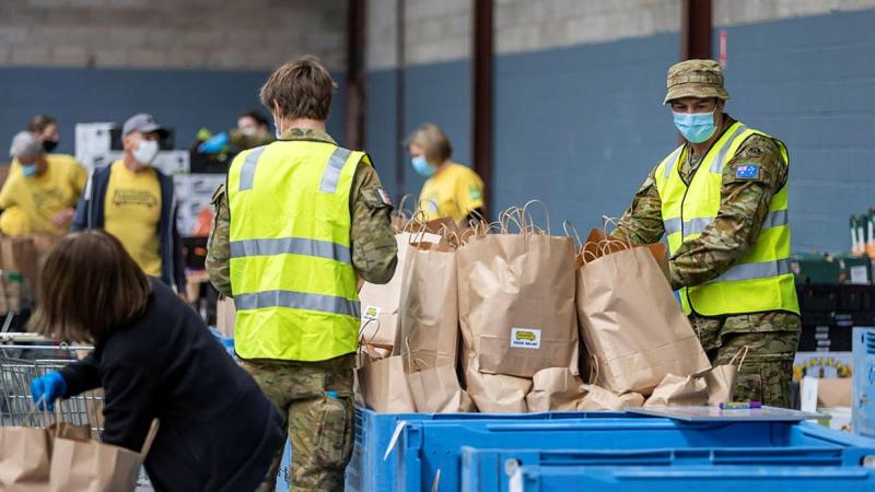 Army personnel and OzHarvest volunteers prepare dry and fresh food hampers in the OzHarvest warehouse at Alexandria, Sydney, a part of Operation COVID-19 Assist. Photo: Corporal Dustin Anderson 