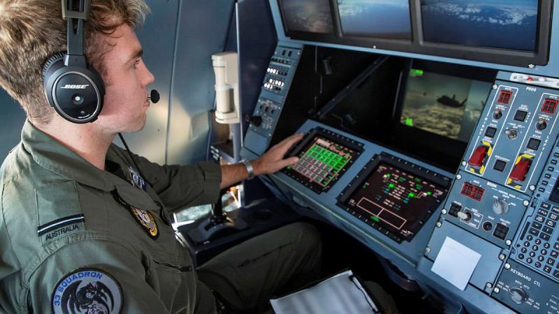 Flying Officer William Delchau, from No. 33 Squadron, supervises an air-to-air refuelling sortie on board a KC-30A multi-role tanker transport aircraft during Exercise Talisman Sabre 2021. Photo: Sergeant Ben Dempster
