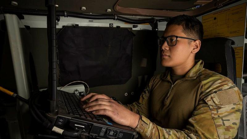 Gunner Akbar Joeharris, from the 4th Regiment, Royal Australian Artillery, monitors the Advanced Field Artillery Tactical Data System inside a command post Bushmaster vehicle during Exercise Talisman Sabre. Photo: Corporal Jarrod McAneney