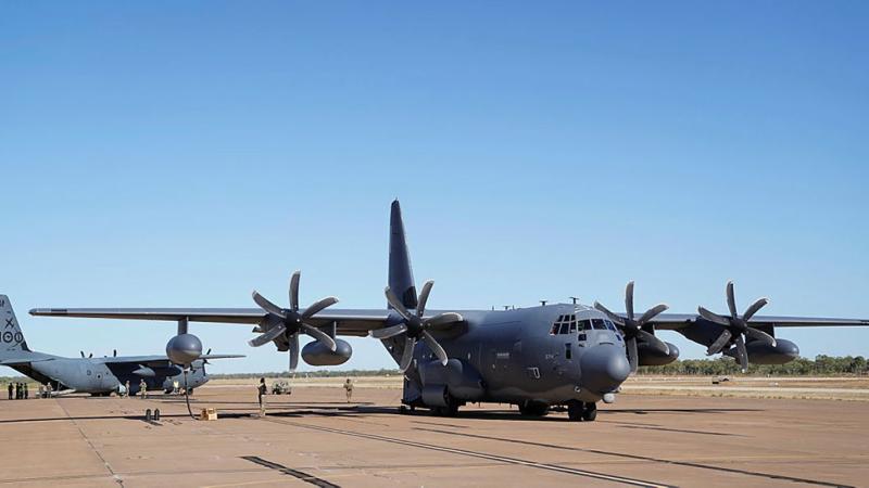 A Royal Australian Air Force C-130J Hercules, left, is refuelled from a U.S. MC-130J Air Commando II during a forward area refuelling point training scenario at RAAF Base Tindal during Exercise Talisman Sabre 2021. Photo: 1st Lt. Joshua Thompson