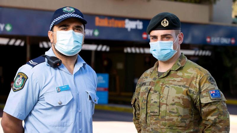 NSW Police and Private Jordan Sayers work together to patrol the Bankstown sports centre in support of the NSW Operation Covid-19 Assist. Photo: Corporal Dustin Anderson 