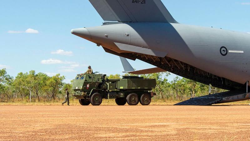 A United States Marine Corps High Mobility Artillery Rocket System is offloaded from a Royal Australian Air Force Boeing C-17 Globemaster III as part of Exercise Loobye. Photo: Captain Carla Armenti