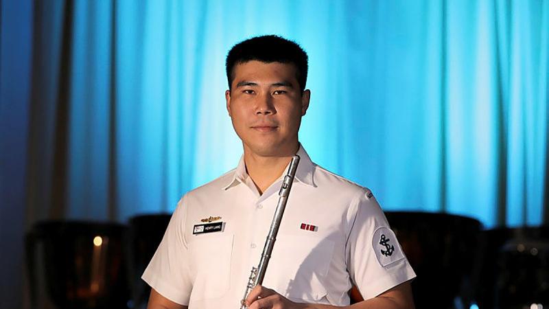 Leading Seaman Henry Liang with his flute. Photo: Petty Officer Nina Fogliani