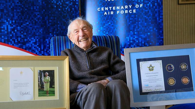 Alan Hastie with an Air Force 2021 Commemorative memento in celebration of his 100th birthday. Photo: Corporal Brett Sheriff 