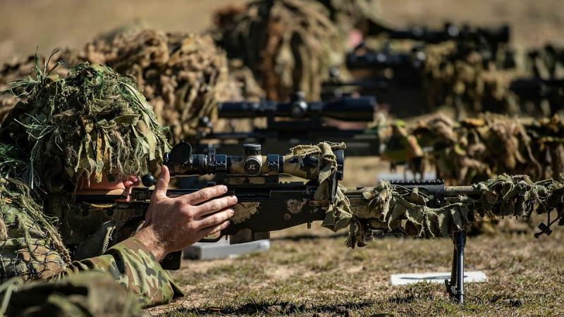 Soldiers from the 6th and 8th/9th Battalions, Royal Australian Regiment, conduct the live-fire phase of the Basic Sniper Course with the SR98 sniper rifle at the Greenbank Training Area. Photo: Private Jacob Hilton