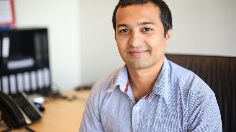 Army reservist Private Varun Marwaha working in his civilian job as an air quality consultant with SLR Consulting.