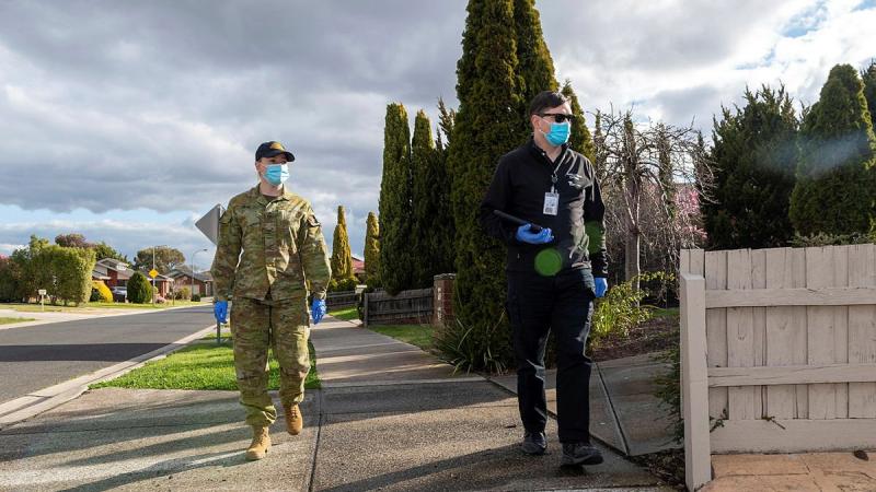 Private Amanda Jones and Victorian Department of Health Authorised Officer Peter Jarvis are part of the COVID-19 Household Engagement Program in support of the Victorian State Government’s response to the COVID-19 pandemic. Photo: Private Michael Currie