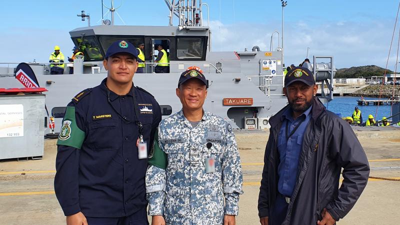 Police Constable Tehapai Marsters (Cook Islands), Warrant Officer Edwin Ong (Singapore) and Chief Petty Officer Timoci Tokaru (Fiji) on the wharf at HMAS Stirling ahead of training with the Sea Training Group - Defence Cooperation Program.