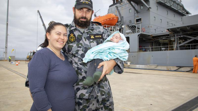 Leading Seaman Jamie Martin is farewelled by wife Teaghan and son Sterling as HMAS Sirius prepares to depart Fleet Base West, Western Australia, for her final deployment. Photo: Leading Seaman Richard Cordell