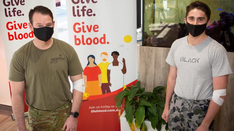 Corporal Matthew Hand and Seaman Connor Black donated plasma towards the Army and Navy tallies at the Canberra Red Cross Lifeblood Donation Centre. Photo: Sergeant Rob Hack