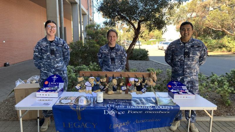 Headquarters Cyber and Electronic Warfare personnel Aircraftwoman Rebecca Hughes, Flight Lieutenant Jennifer Woodside and Leading Aircraftman Kuldeep Pegu collect fundraising money during Legacy Week at Defence Science and Technology Group, Edinburgh.