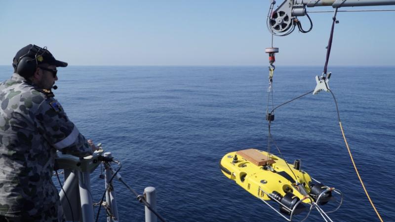 Leading Seaman Dale Timbs launches remotely operated vehicle Double Eagle to search for a simulated mine off the coast of Evans Head, NSW. Photo: Midshipman Jack Hawkins.