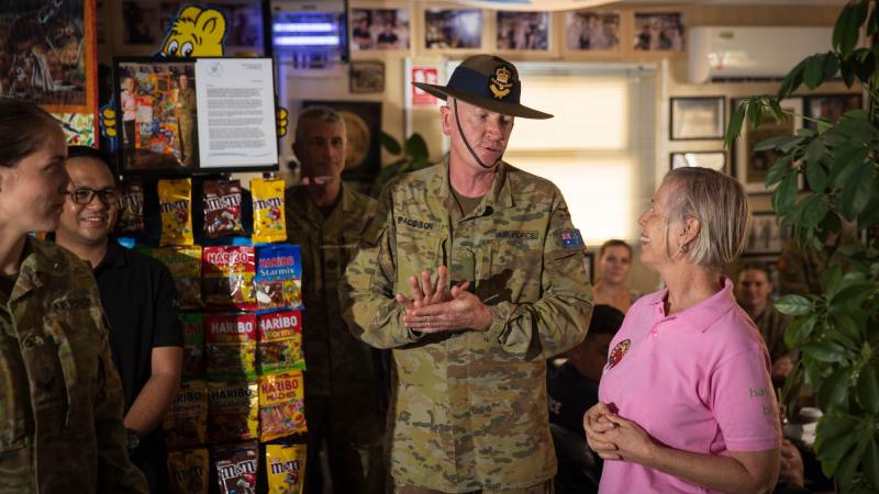 Commander Joint Task Force 633 Air Commodore David Paddison celebrates the 10th anniversary of the ‘Bean around the MEAO’ café with owner Aileen Stoddart. Photo: Sergeant Glen McCarthy