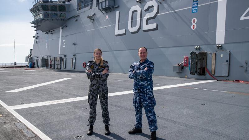 Able Seaman Ashley Lehmann and her stepfather Squadron Leader Joey Slater are working together on board HMAS Canberra during Indo-Pacific Endeavour. Photo: Leading Seaman Nadav Harel