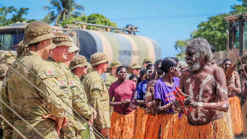 Members of the Pormpuraaw Arts Centre Dance Group greet the Army contingent during the AACAP 2021 opening ceremony.