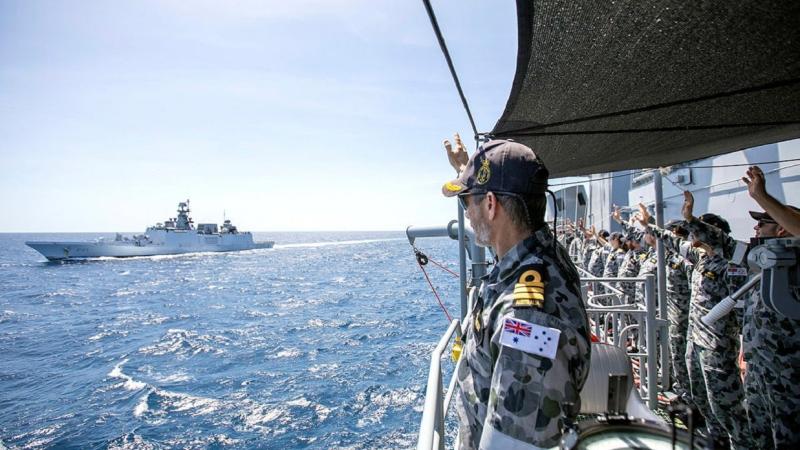 Commanding Officer HMAS Warramunga Commander Stewart Muller and the ship's company farewell Indian Navy Ships Shivalik and Kadmaat at the conclusion of AUSINDEX 2021. Photo: Petty Officer Yuri Ramsey