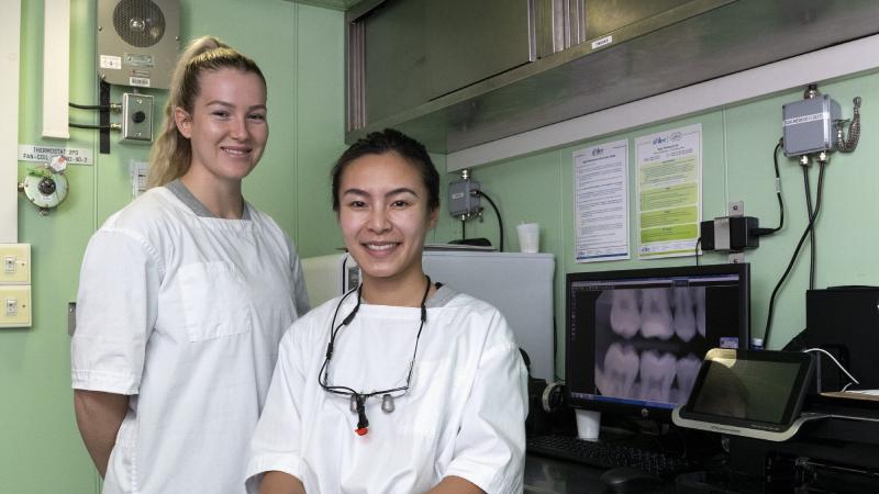 Able Seaman Dental Assistant Caitlin Taylor, left, and Dental Officer Lieutenant Danica Zhan are embarked on HMAS Canberra to care for the dental health of the task group during Indo-Pacific Endeavour. Photo: Leading Seaman Nadav Harel