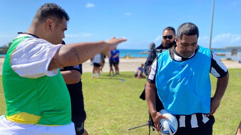 Tongan participants Vaopako Pongi, left, and Lolomanoia Tuifua enjoy a practical session for rugby league coaches, including game-day drills.