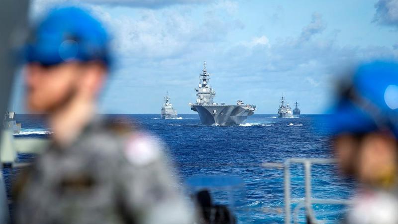 Warships from the Japan Maritime Self-Defense Force, Indian Navy and United States Navy take station behind HMAS Warramunga during Exercise Malabar 2021. Photo: Petty Officer Yuri Ramsey