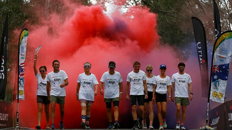 Australian and American ultramarathon runners celebrate the completion of the 1000 Miles to Light run held around Singleton Military Area, NSW.