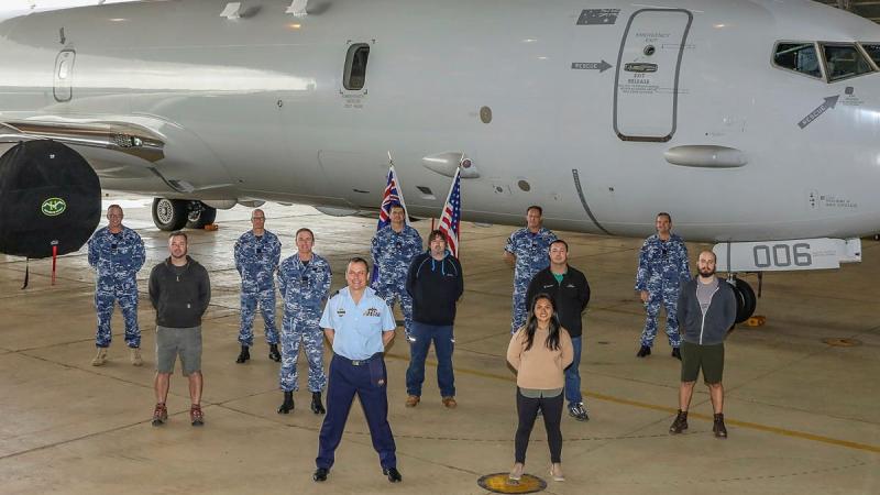 Officer Commanding No. 92 Wing, Group Captain John Grime, front centre, stands with staff and personnel from Surveillance and Response Systems Program Office, No. 92 Wing and Boeing in front of P-8A Poseidon A47-006. Photo: Corporal Brenton Kwaterski 
