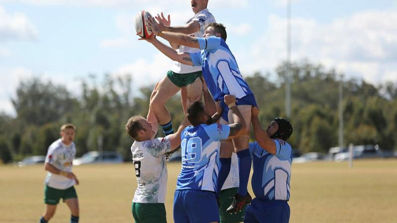 A player from the Royal Australian Corps of Signals Rugby Union Football Club team rises above a Toowoomba Police player in the annual Brett Forte Cup memorial rugby game in Queensland. Photo: Corporal Joshua Thomas