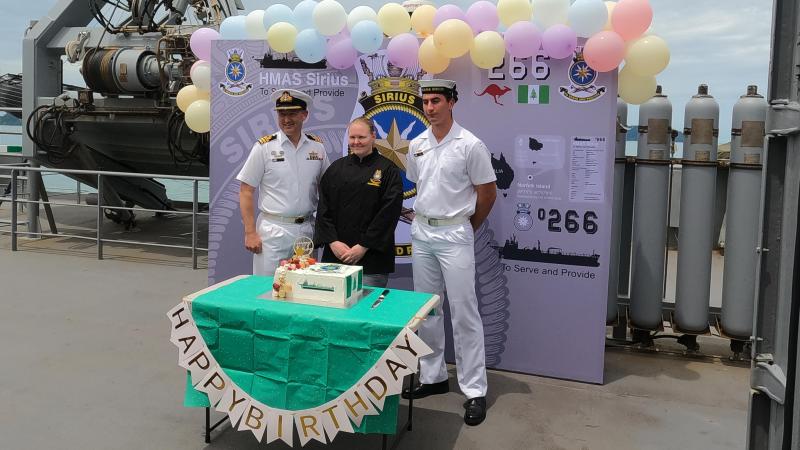 Commanding Officer HMAS Sirius Commander Chris Doherty, left, Leading Seaman Esler Cartledge and Seaman Leroy O’Connor celebrate the ship's 15th birthday.