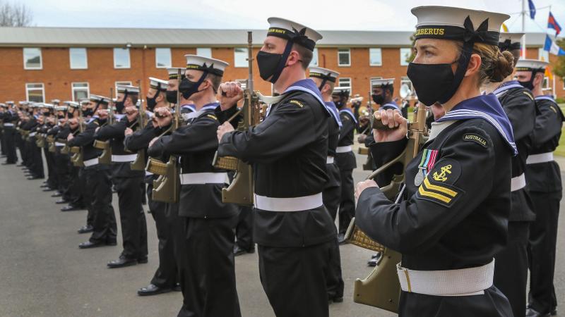 Recruit School Instructor Leading Seaman Kelsie Wright presents Arms during the graduation ceremony on the parade ground of RAN Recruit School, HMAS Cerberus, Victoria. Photo: Petty Officer James Whittle
