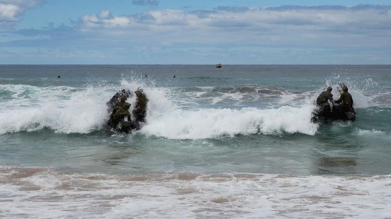Special operations forces trainees from the ADF School of Special Operations practise their boat-handling and landing skills in Zodiac inflatable boats in the surf at Wanda Beach, Sydney. Photo: Leading Seaman Benjamin Ricketts
