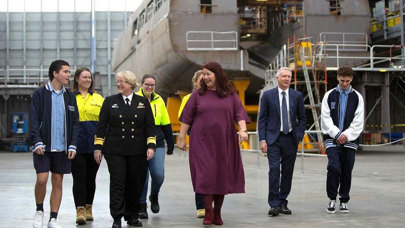 Minister for Defence Industry Melissa Price, Rear Admiral Wendy Malcolm, and CIVMEC Executive Chairman Jim Fitzgerald with Year 12 students and South Metropolitan TAFE students at Henderson shipyard, WA. Photo: Petty Officer Yuri Ramsey