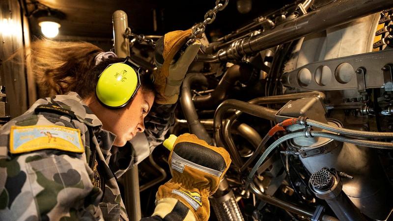Able Seaman Maddie Hohnberg conducts maintenance on HMAS Warramunga's gas turbine. Photo: Petty Officer Yuri Ramsey