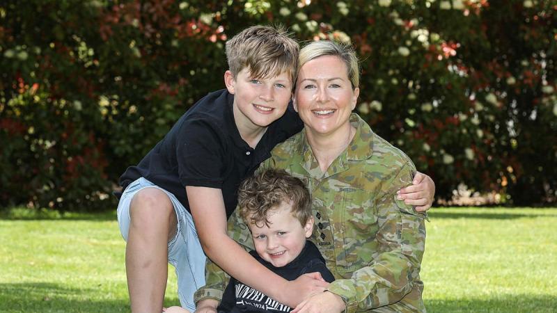 Captain Laura McCarthy is serving part-time under Service Category 3, and is pictured with her children at home. Photo: Corporal Brenton Kwaterski
