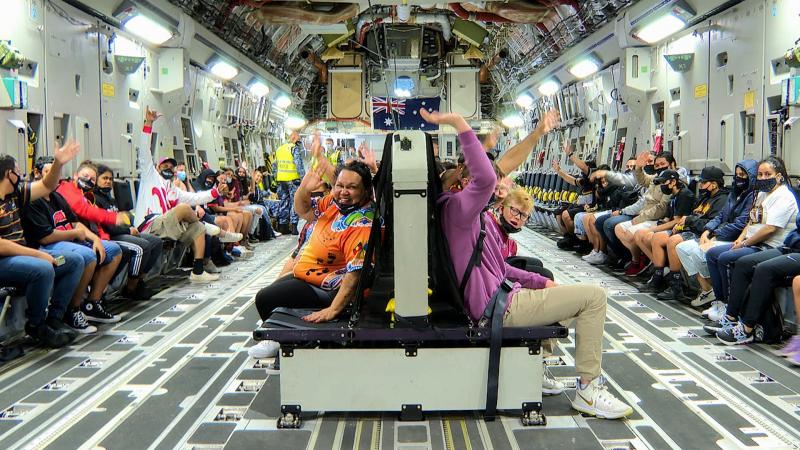 Ipswich Indigenous community members and children inside a C-17A Globemaster III for a flight from RAAF Base Amberley. Photo: Sergeant Peter Borys