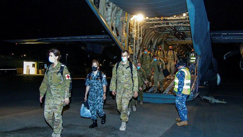 ADF deployed as part of Operation PNG Assist and Department of Foreign Affairs and Trade personnel disembark a No. 37 Squadron C-130J Hercules in Papua New Guinea.