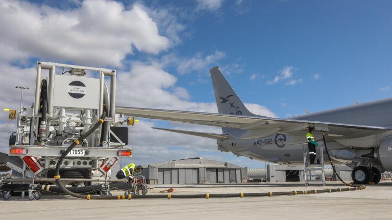 Leading Aircraftman Peyman Zeinali, left, and Leading Aircraftman Nicolas Ballingal use RAAF Base Edinburgh's in-ground refuelling system for the first time with an Air Force P-8A Poseidon. Photo: Corporal Brenton Kwaterski