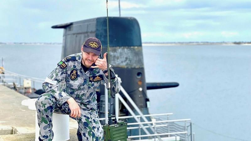 Able Seaman Nathan Mayfield uses a Harris PRC-150 HF radio set.