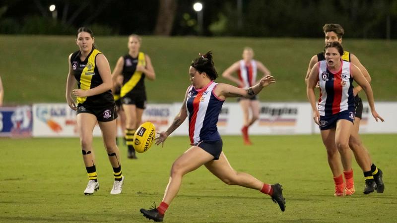 Corporal Rhian Mears, of 3rd Brigade Headquarters, plays for the Curra Swans Australian Rules football team during their grand final win in Townsville. Photo: Corporal Brodie Cross