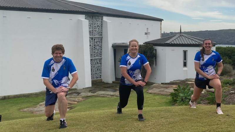 Commanding Officer HMAS Watson Commander Tina Brown, Warrant Officer Nigel Jeffers and Petty Officer Jessica Fisher take part in the Legacy lunge challenge held at HMAS Watson.
