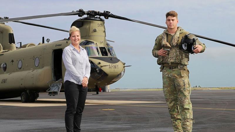 Townsville Defence Weather Service Office manager Krystelle Venn with 5th Aviation Regiment's Lieutenant David Selvage at RAAF Base Garbutt, Queensland. Photo: Lance Corporal Lisa Sherman