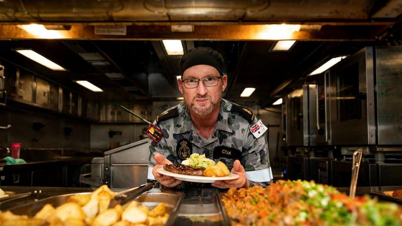 Able Seaman Clayton Cox prepares for dinner service in the galley on board HMAS Anzac during Indo-Pacific Endeavour 21. Photo: Leading Seaman Leo Baumgartner